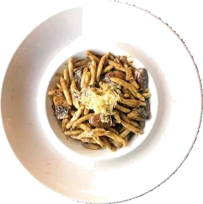Sautéed wild mushrooms in a white bowl
