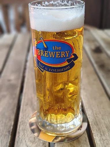 A chilled glass of The Brewery draught beer