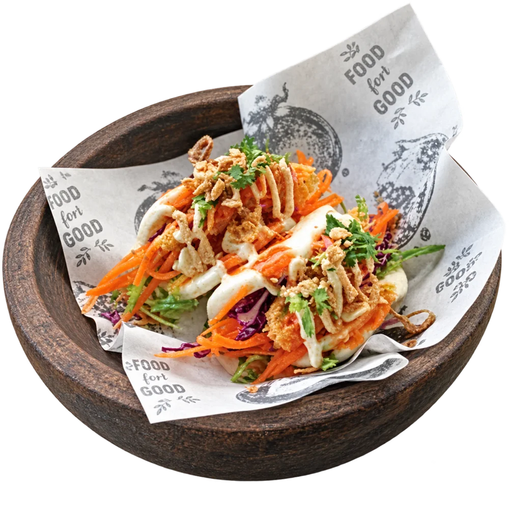 Loaded tacos in a wooden bowl