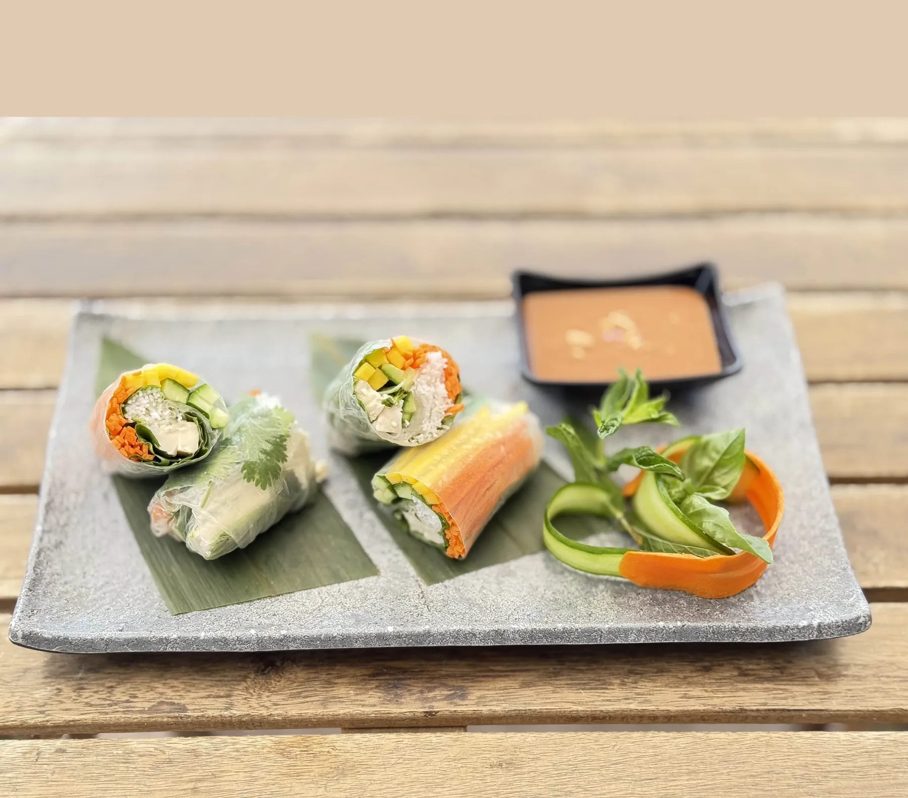 Fresh vegetable spring rolls with herbs and dipping sauce