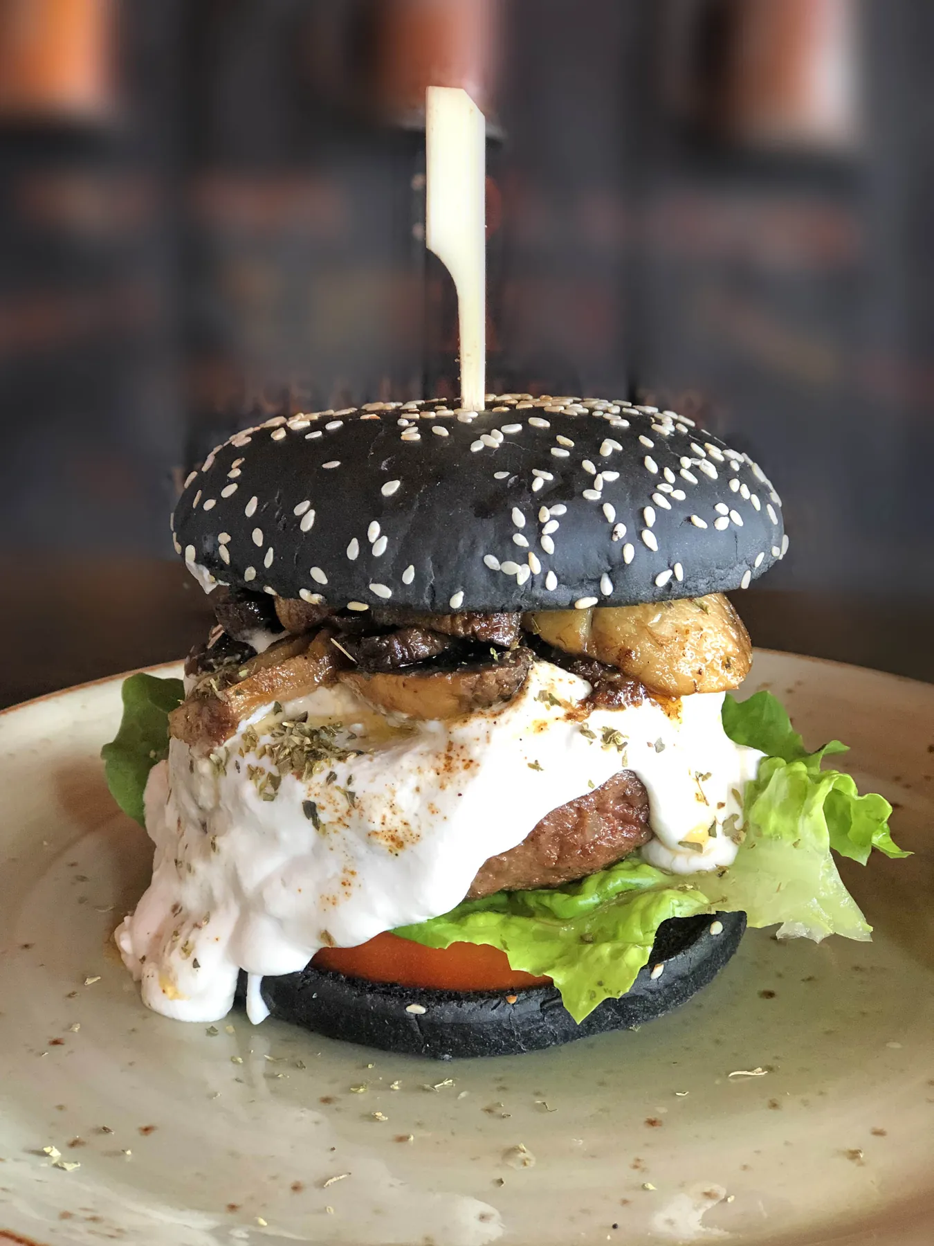 Black sesame burger with goat cheese, mushrooms and lettuce