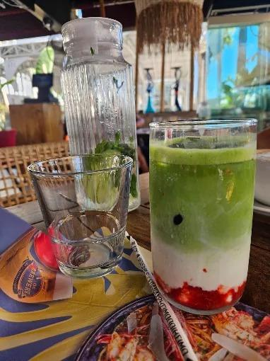 A layered green and strawberry drink at The Brewery